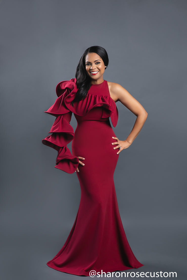 maroon dress engagement photos An engagement look designed to command silence the moment she enters the room. Crafted in deep maroon sequins with a sculpted off-shoulder drapery, this silhouette embraces understated glamour through a sleek straight